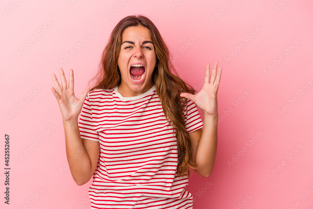 Young caucasian woman isolated on pink background screaming to the sky, looking up, frustrated. Young caucasian woman isolated on pink background screaming to the sky, looking up, frustrated.