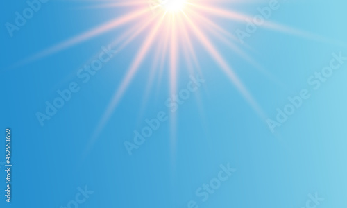 Bright sun on a blue background. Sun glare. 
