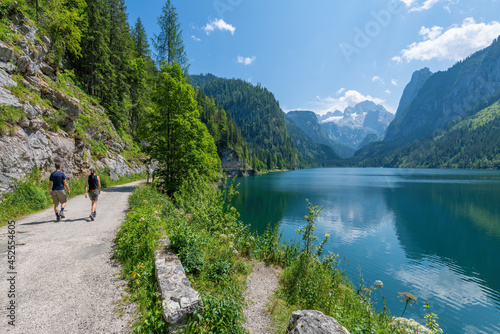 Gosausee, Austria  July 31, 2021 - People hiking at Gosausee, a beautiful lake with moutains in Salzkammergut, Austria. © Nick Brundle