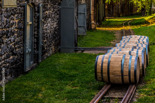 Photo Bourbon barrels lined up to roll.
