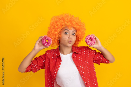 fancy kid with glazed doughnut calories. food and dessert. donut bakery. teen girl having fun.