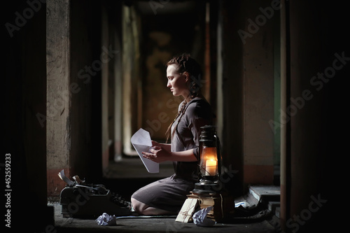 A girl with old books in the old house