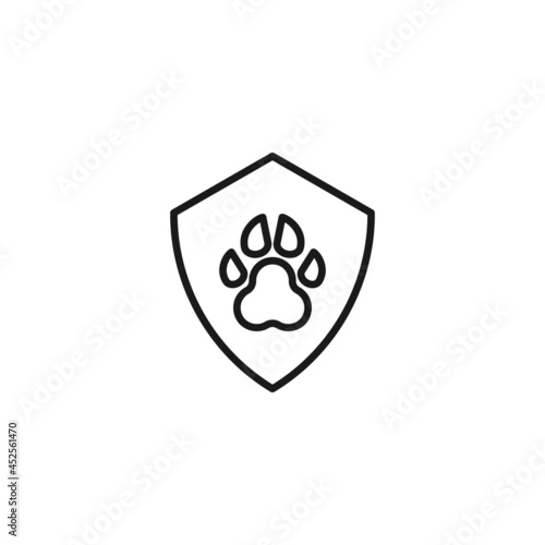 Line icon of dog's paw in cenrer on shield