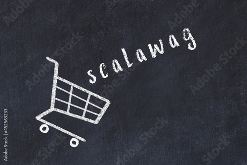 Chalk drawing of shopping cart and word scalawag on black chalboard. Concept of globalization and mass consuming photo