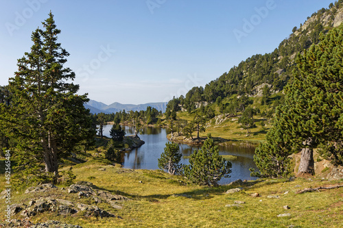 The shores of Achard Lake in Chamrousse resort, Belledonne range, French Alps photo