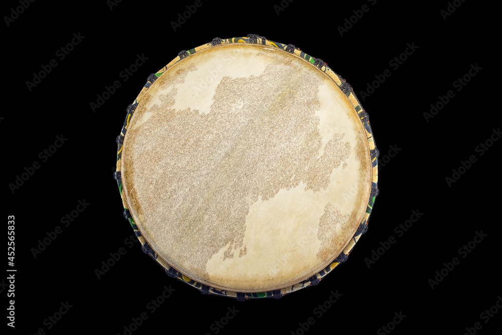 top view of an african traditional djembe on black background top view of an african traditional djembe on black background