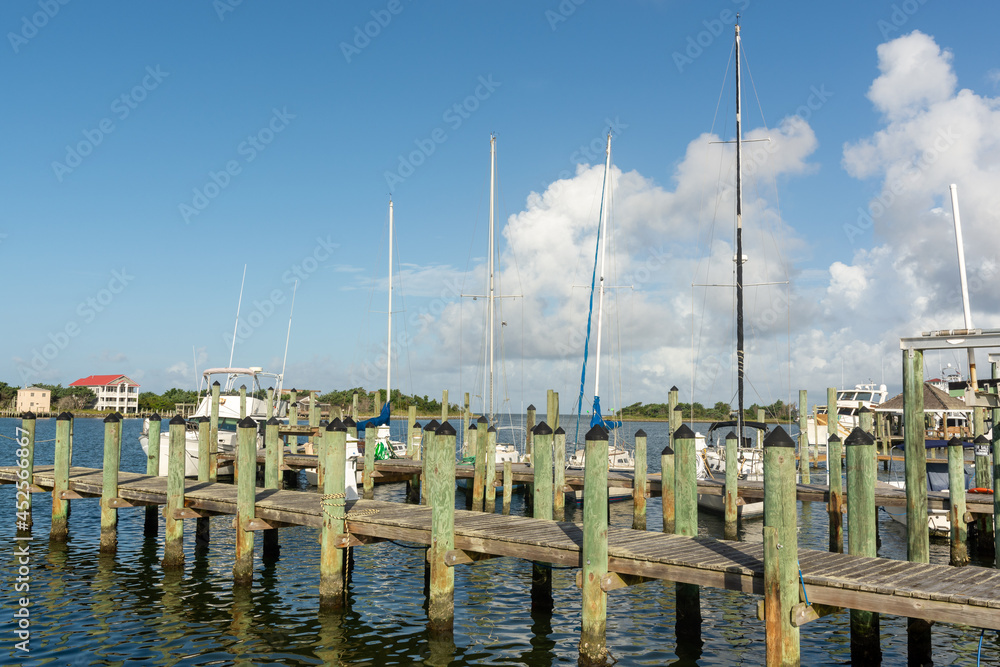 Fishing and sailboats docked on the piers in Silver Lake on Ocracoke Island.
