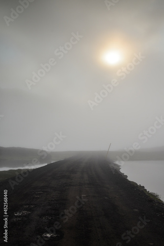 A misty and moody sunset on the mountain road through the pass to Mj  ifj  r  ur fjord  East Fjords  Iceland