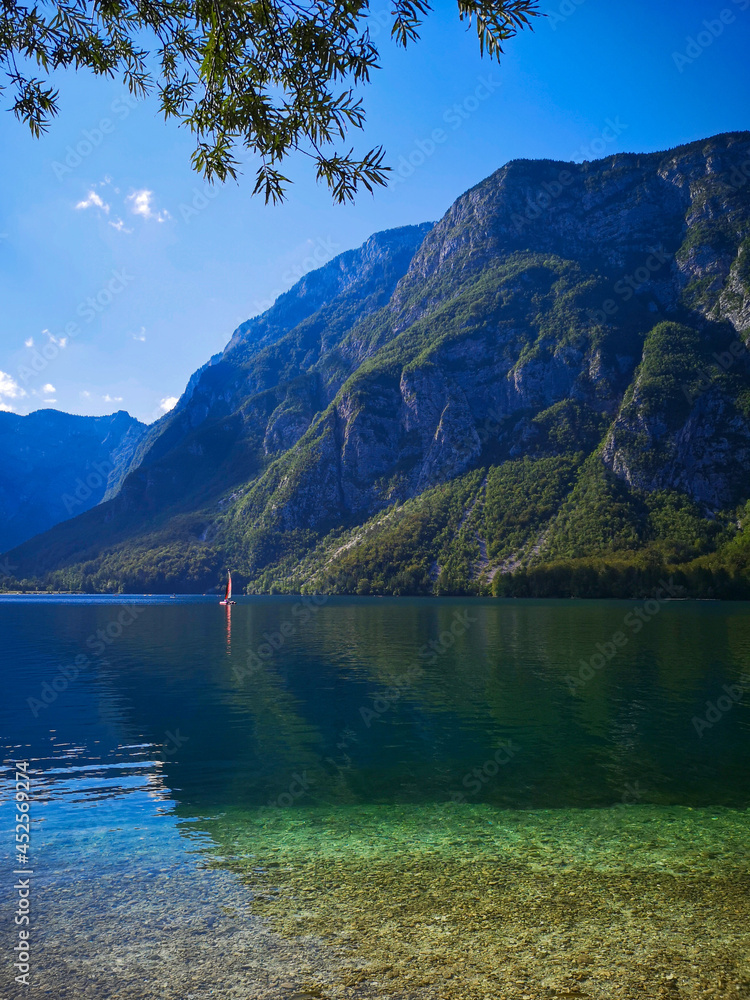 the beautiful clear lake bohinj with view on the mountains 