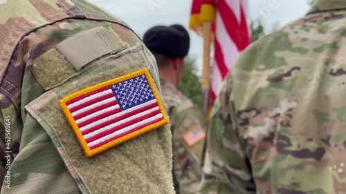 US soldiers. US army. USA patch flag on the US military uniform. Soldiers on the parade ground from the back. Veterans Day. Memorial Day.