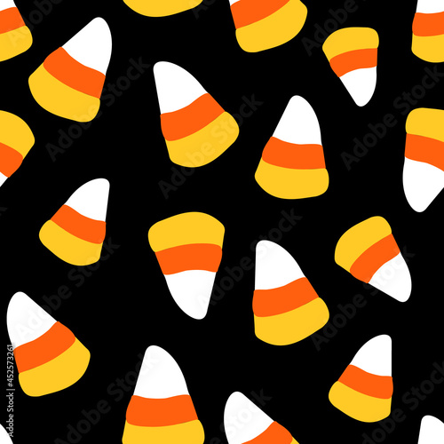 All over Halloween seamless vector repeat pattern with candy corn tossed on black background