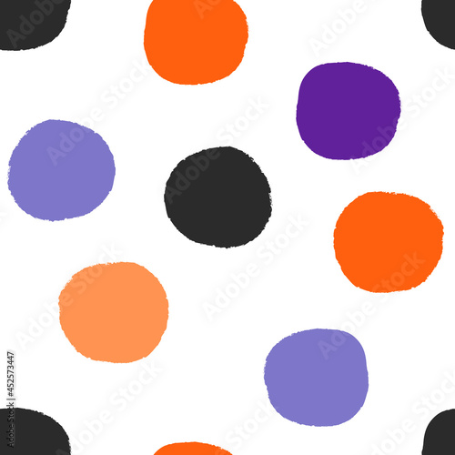 All over Halloween seamless repeat pattern with big bold red irregular rough edge hand-drawn polka dots tossed on a white background