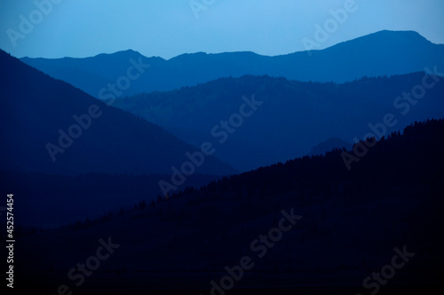 Fototapeta Naklejka Na Ścianę i Meble -  Layers of Mountains in Distance Smoke Mist