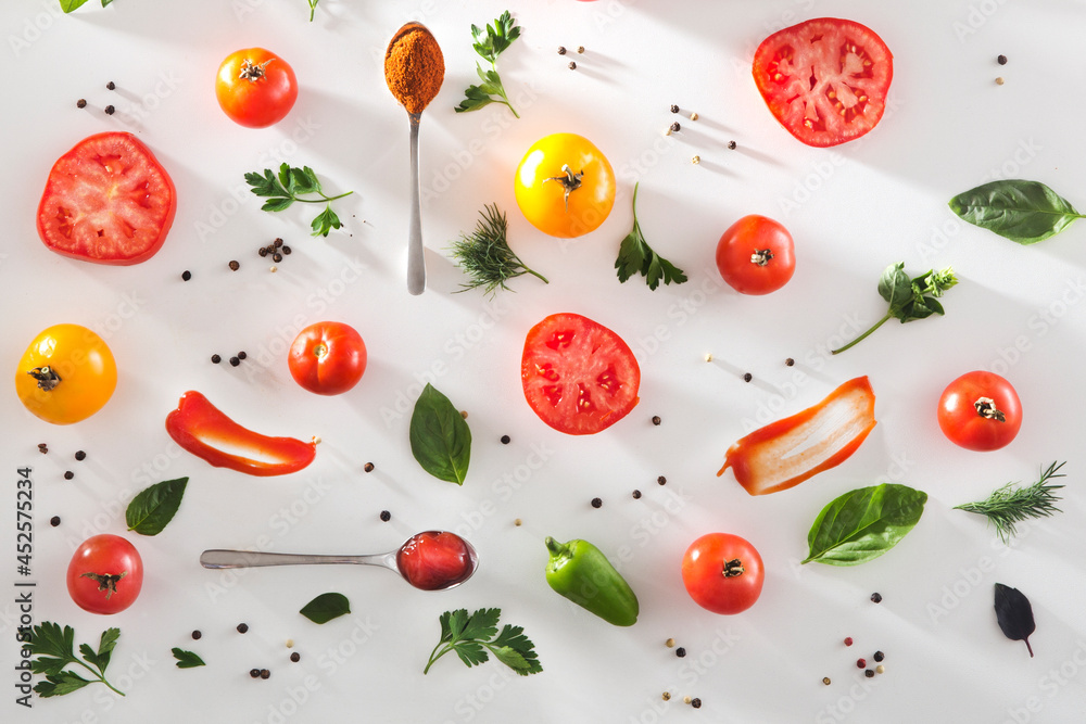 Flat lay of cut vegetables Tomato, basil, spices, pepper, parsley on white wooden background. cooking concept. salad ingredients Flat lay of cut vegetables Tomato, basil, spices, pepper, parsley on white wooden background. cooking concept. salad ingredients
