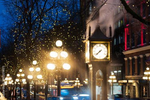 Gastown Steam Clock and downtown beautiful street view at night. Cambie and Water Street. Vancouver, Canada.