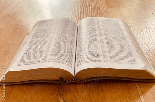 The open Bible lies on the table 