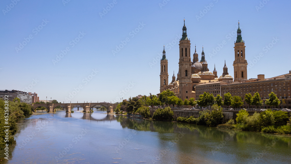 Cathedral Basilica of Our Lady of Pillar with bridge and Ebro river at Zaragoza