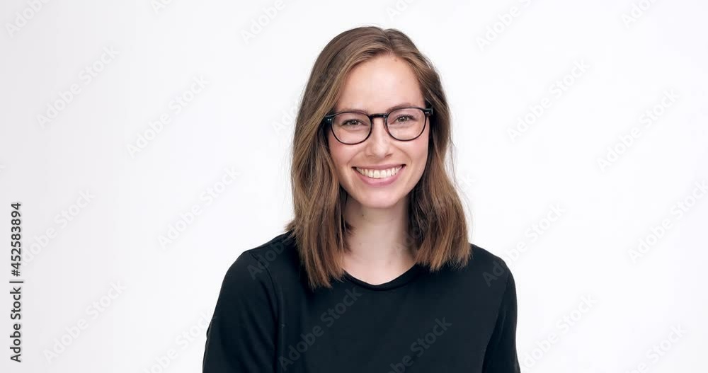 High quality portrait of a beautiful and confident business woman with glasses giving thumbs up and looking successful. High quality 4K footage High quality portrait of a beautiful and confident business woman with glasses giving thumbs up and looking successful. High quality 4K footage