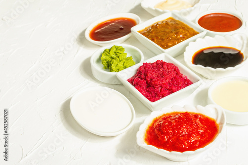 Set of different sauces - ketchup  mayonnaise  barbecue  soy  chutney  wasabi  adjika  horseradish