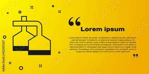 Black Traditional brewing vessels in brewery icon isolated on yellow background. Beer brewing process. Distillery plant, brewery. Vector