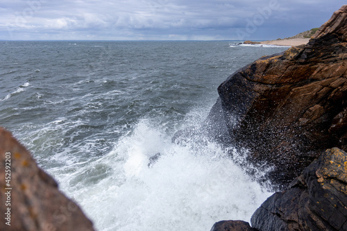 waves crashing on rocks