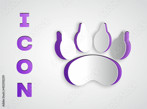 Paper cut Bear paw footprint icon isolated on grey background. Paper art style. Vector