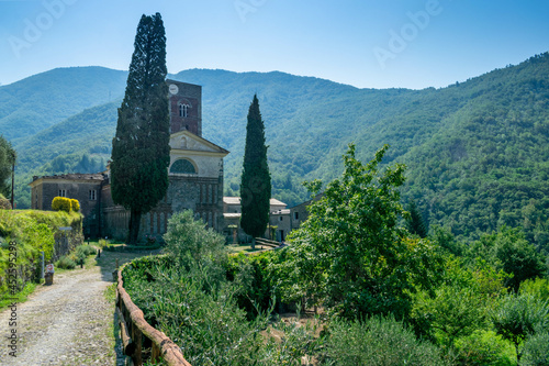 Sant Andrea di Borzone Abbey surrounded by beautiful greenery in Genoa, Italy photo