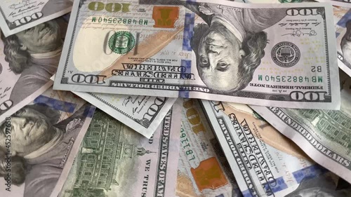 Spinning cash US money banknotes of new 100 dollars. 4K, Close up.