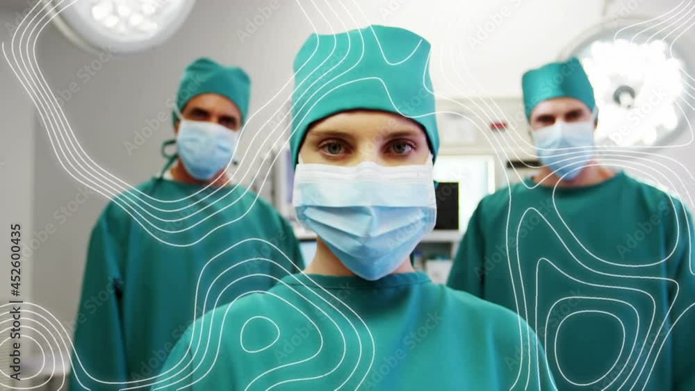 Animation of moving lines over surgeons in face masks Animation of moving lines over surgeons in face masks