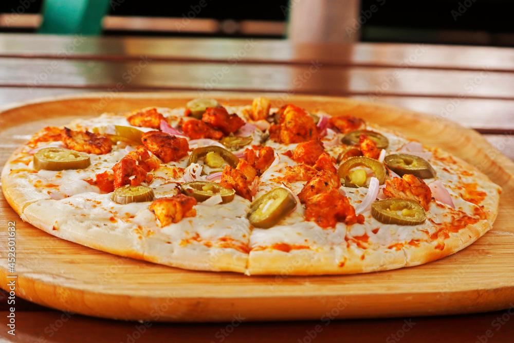 spicy chicken pizza, spiced chicken cubes and mozzarella cheese combination on flat bread, italian food