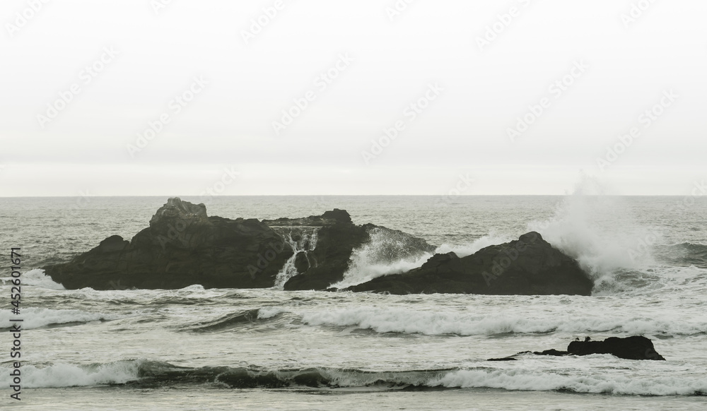 waves crashing on sea rocks