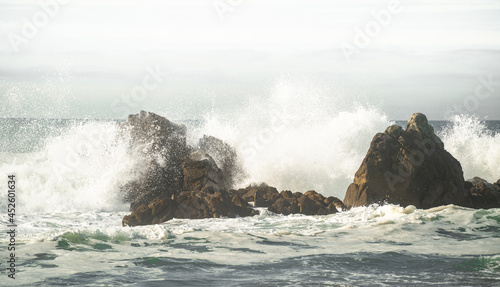 crashing waves on sea rock