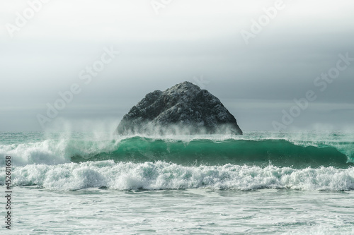 waves and lonely sea rock