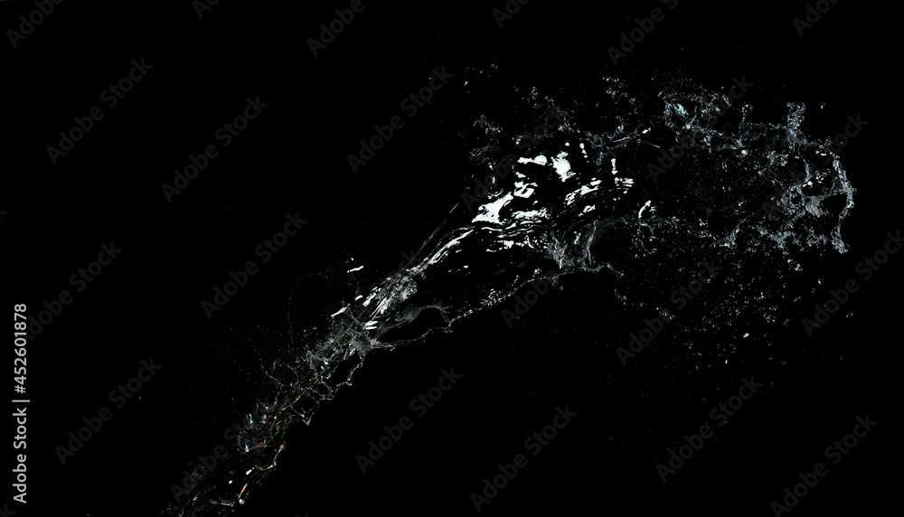 long stream of fresh transparent water isolated on black background. Splash and splash