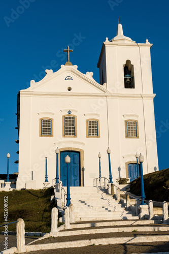View of the Church of Nossa Senhora da Nazaré located in Saquarema, Rio de Janeiro. Sunny day. Stairs and the church on top of the hill