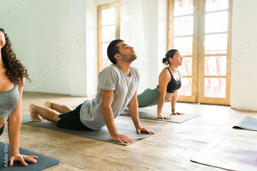 Relaxed yogis exercising together