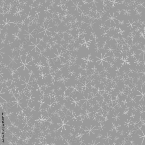 Hand Drawn Snowflakes Christmas Seamless Pattern. Subtle Flying Snow Flakes on chalk snowflakes Background. Beauteous chalk handdrawn snow overlay. Bizarre holiday season decoration.