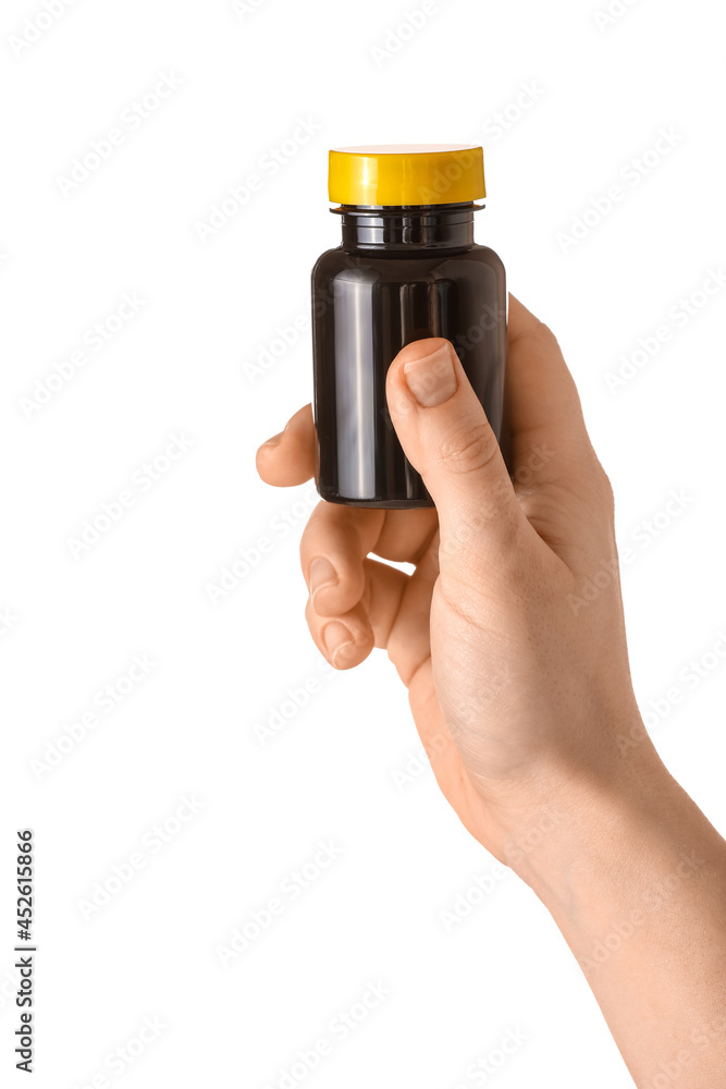Female hand and medical bottle on white background Female hand and medical bottle on white background