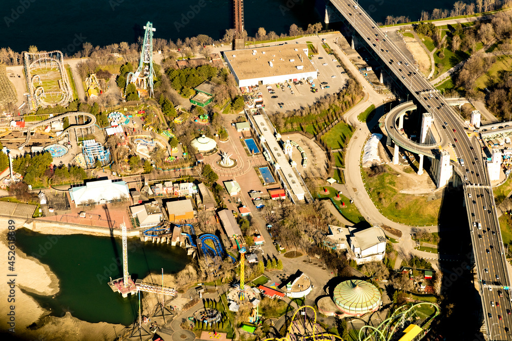 Fototapeta premium Aerial view of St. Lawrence River, La Ronde amusement park (six flags) and Jacques-Cartier bridge, Montreal, Canada.