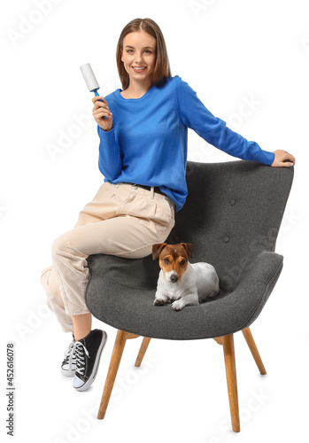 Young woman with lint rolle...