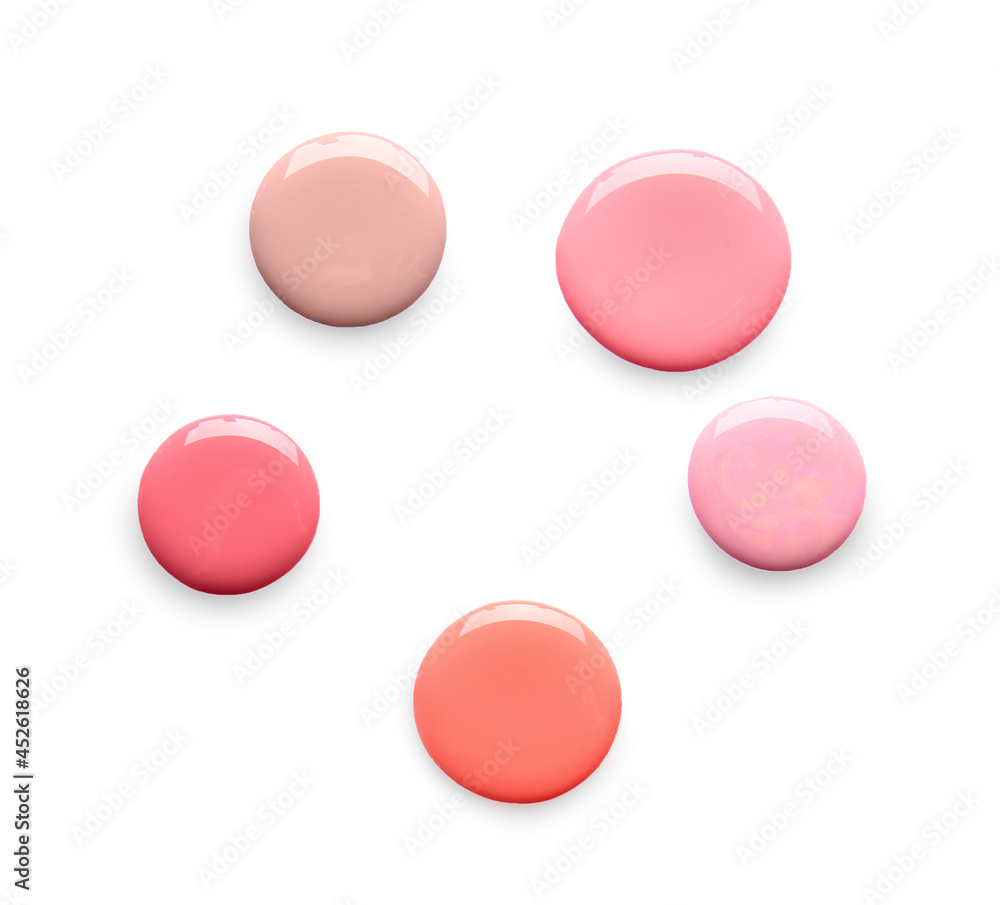 Drops of nail polishes on white background Drops of nail polishes on white background