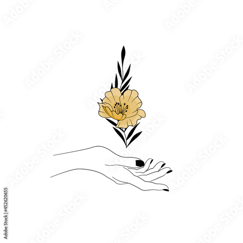 Kobieca dłoń trzymająca kwiat. Złoty kwiat, gałązka i smukła dłoń z czarnym manicure. Mistyczny gest, symbol magii, minimalistyczny design.