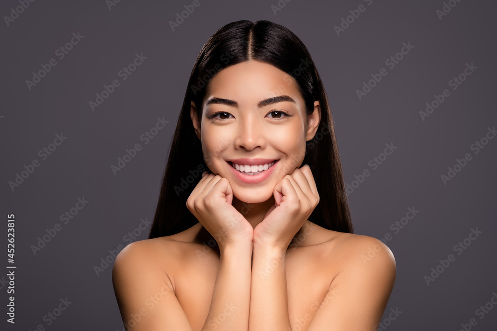 Photo of adorable lovely asian model relaxing cute chinese lady hands cheekbones isolated grey color background Photo of adorable lovely asian model relaxing cute chinese lady hands cheekbones isolated grey color background