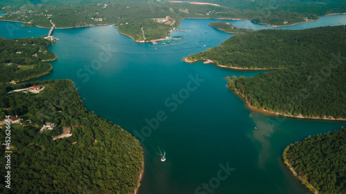 Top view of the river and its spills. The river is located near the forest. High quality photo