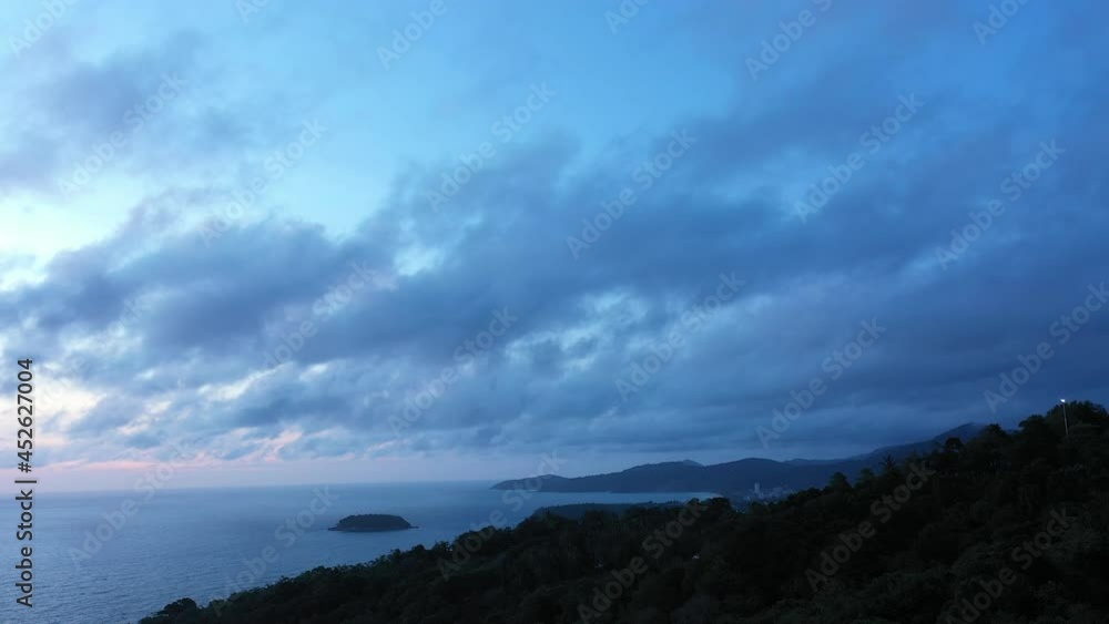 aerial view sunset above the ocean beautiful sunset above the ocean aerial view above the big trees on the high mountain.video 4K. Scene of sweet cloud in the sky background. aerial view sunset above the ocean beautiful sunset above the ocean aerial view above the big trees on the high mountain.video 4K. Scene of sweet cloud in the sky background.