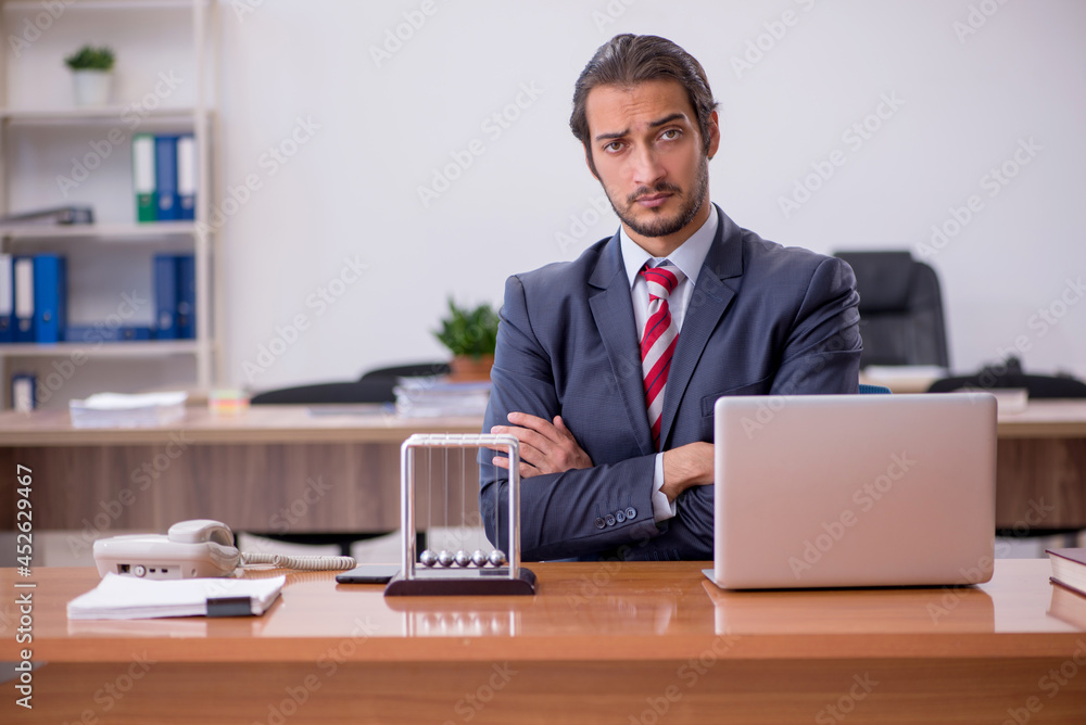 Young man businessman employee sitting in the office Young man businessman employee sitting in the office