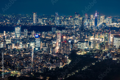 Photography View from above the famous Mori Tower Skydeck of Tokyo metropolis at night with the partial view of the Olympic Stadium when under construction in 2018, Japan