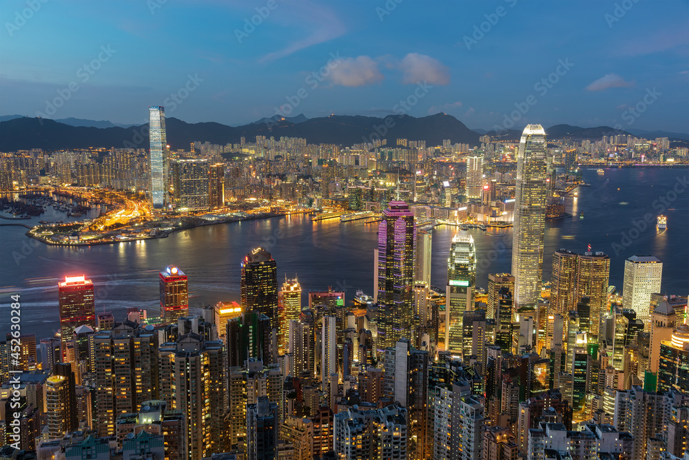 Scenery of Victoria harbor of Hong Kong city at dusk, viewed from the peak