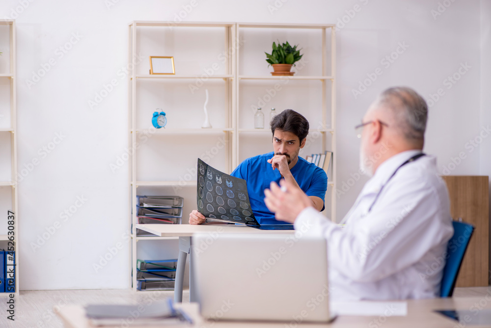 Two male doctors working in the clinic Two male doctors working in the clinic