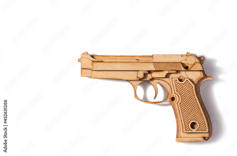 Wooden pistol on a white background. Children's toy Wooden pistol on a white background. Children's toy